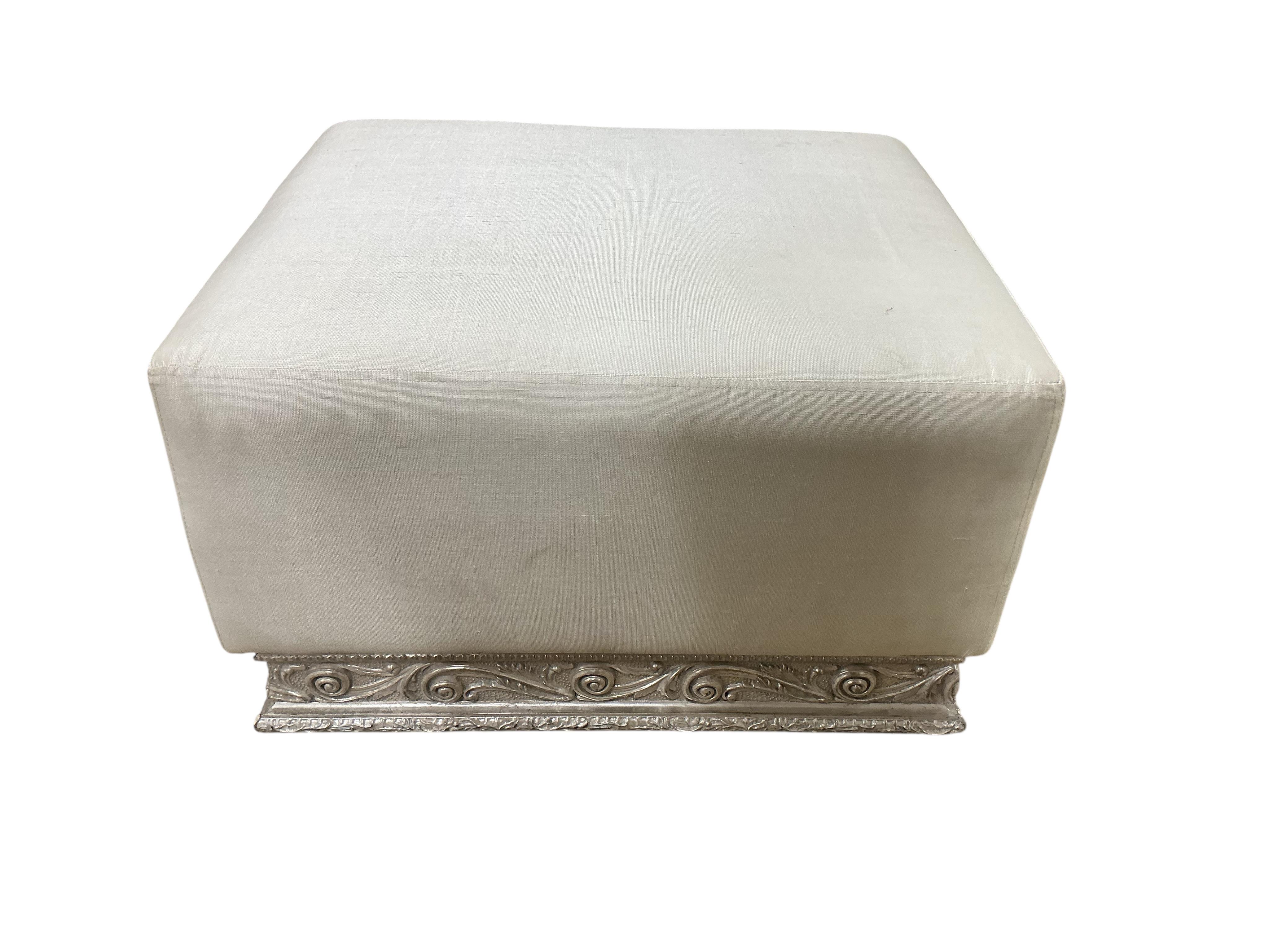 A pair of contemporary ivory fabric and silvered wood stools, width 70cm, depth 60cm, height 44cm